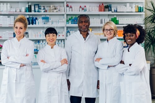 Team of pharmacists smiling.
